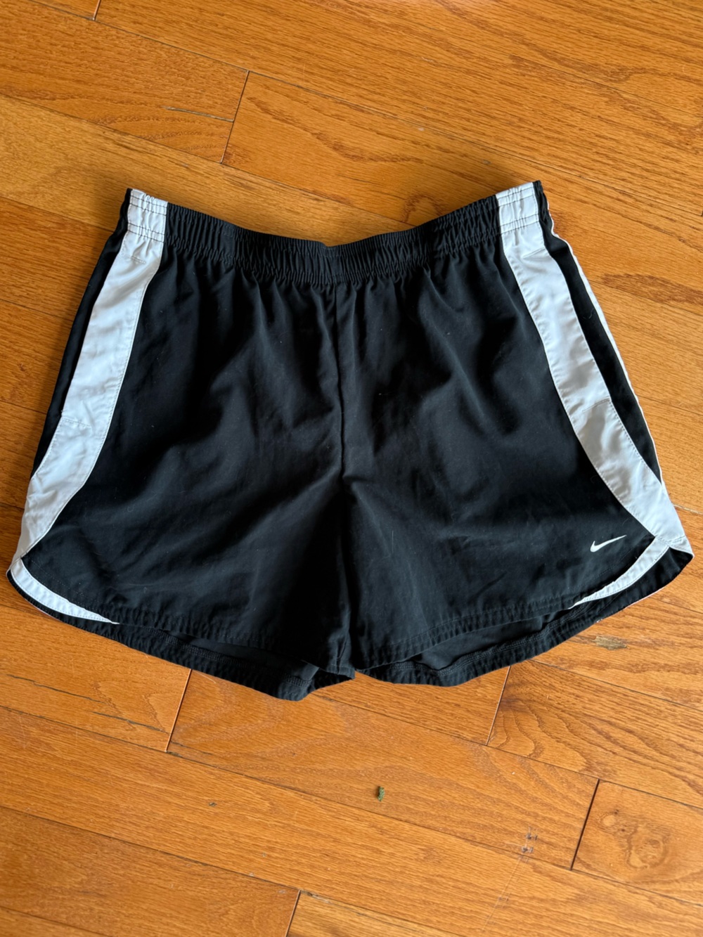 Nike Women’s Black 4-inch Shorts with White Stripes and Pockets, Medium